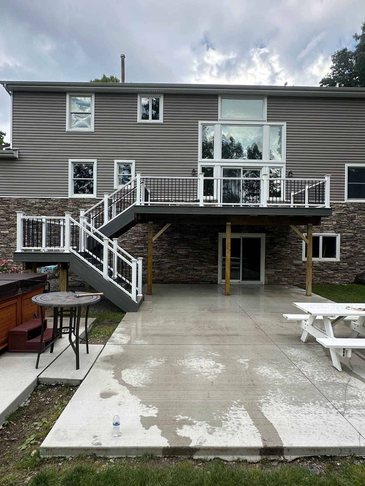 Finished elevated deck and stairs viewed from the patio in Clarkston