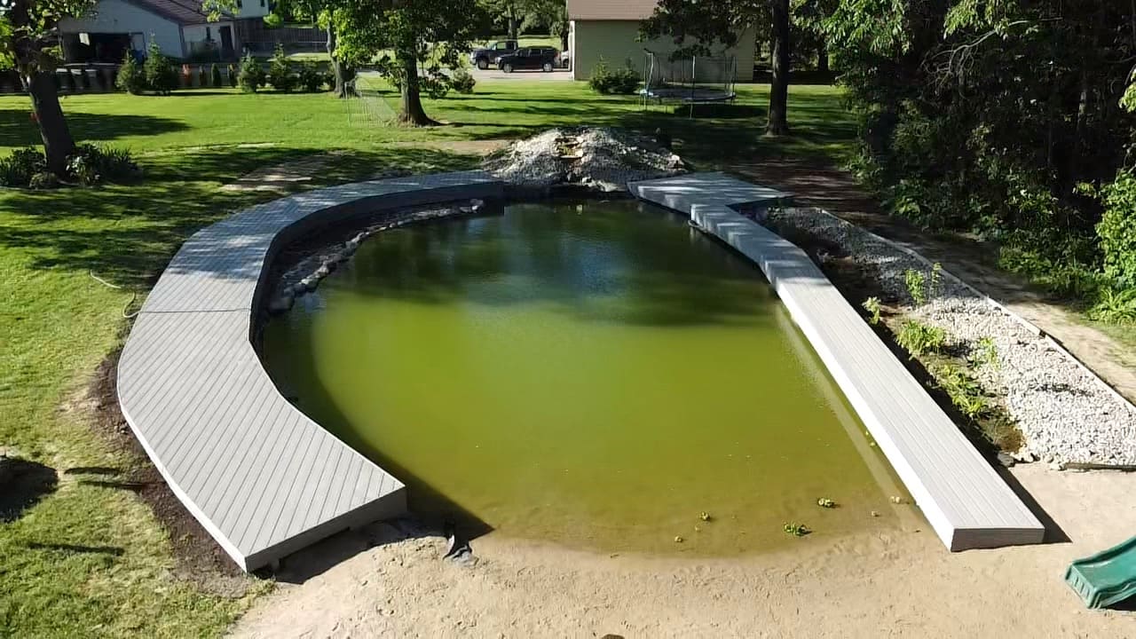 Finished curved walkway around the Commerce pond