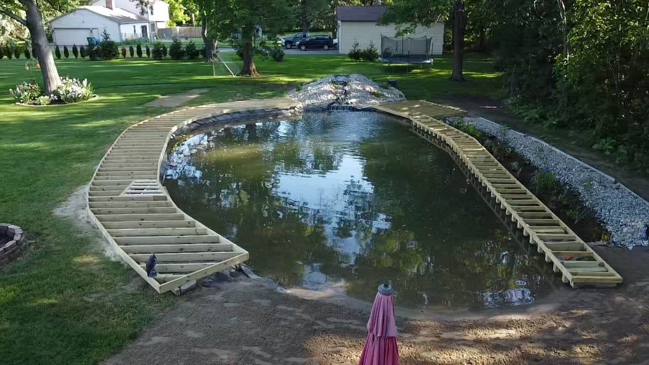 Pond walkway framing viewed across the water in Commerce